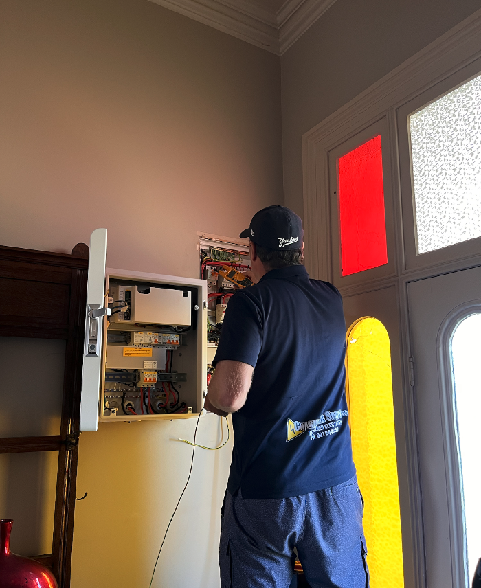 domestic electrician working in a Ngatea home